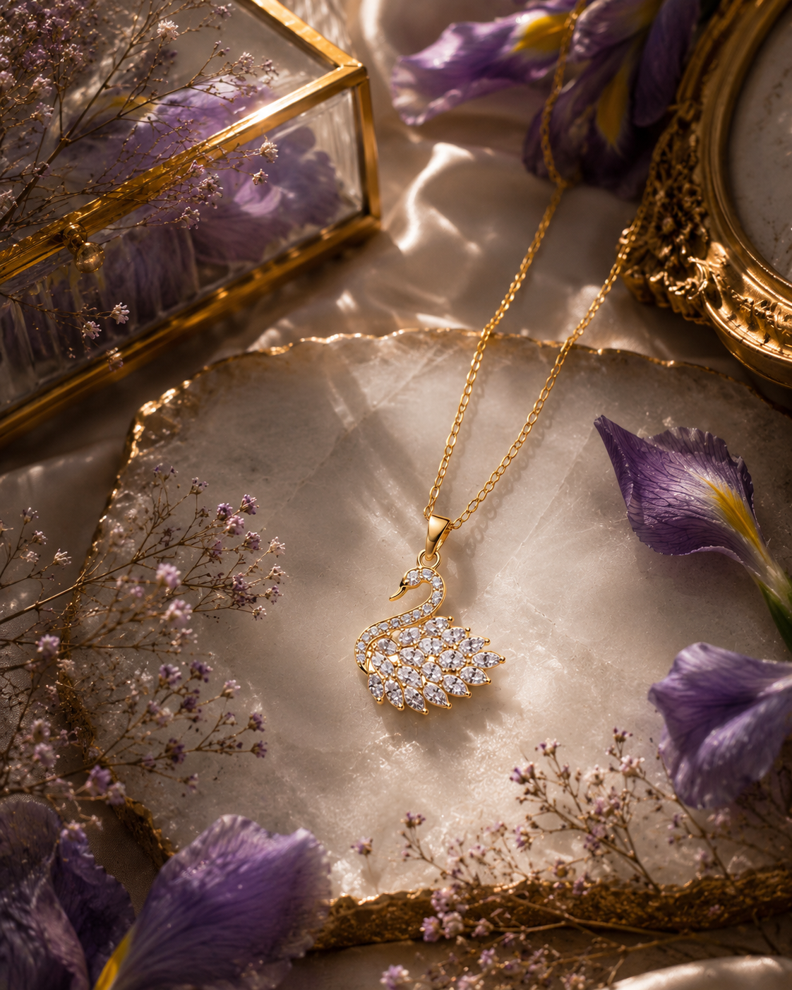 Swan Elegance Crystal Pendant Necklace featuring a graceful swan silhouette decorated with sparkling clear crystals and a gold-tone chain.