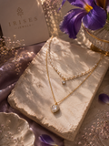 Pearl heart layered necklace with a sparkling heart pendant and delicate gold-tone chain by Irises Jewels.