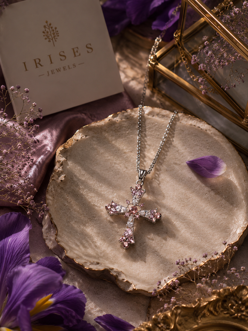 Rosé Crystal Cross Pendant Necklace featuring sparkling blush-pink crystals set in an elegant silver-tone cross design.