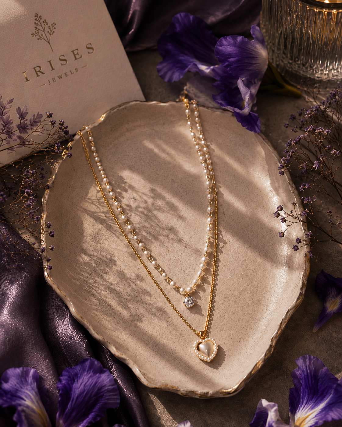 Pearl Heart Layered Necklace featuring a faux pearl strand, sparkling crystal charm, and heart-shaped pearl pendant in a gold-tone finish.